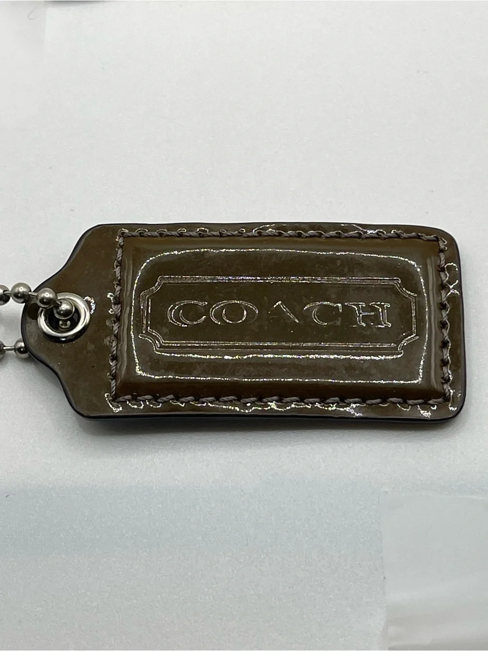 COACH Patent Leather Hang Tag Brown and Iridescent Gray